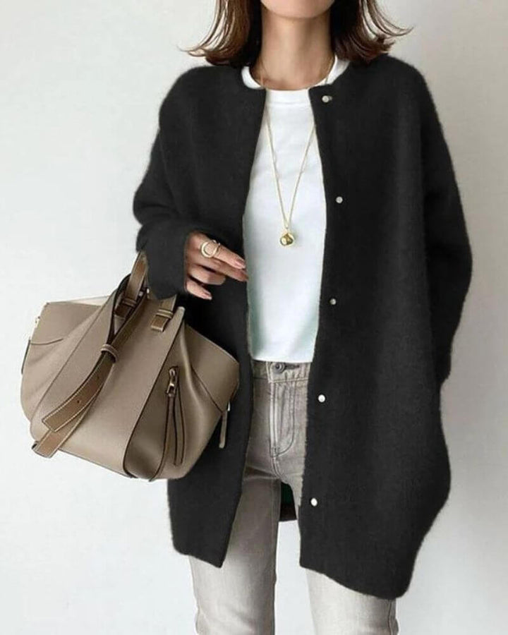 Stylish women's long-sleeve knitted cardigan, a cozy open-front sweater perfect for soft, warm comfort.