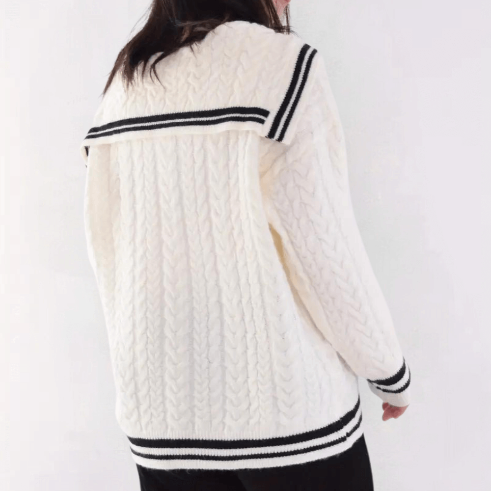 Woman wearing a warm, casual knit sweater, ideal for cozy fall and winter outfits.