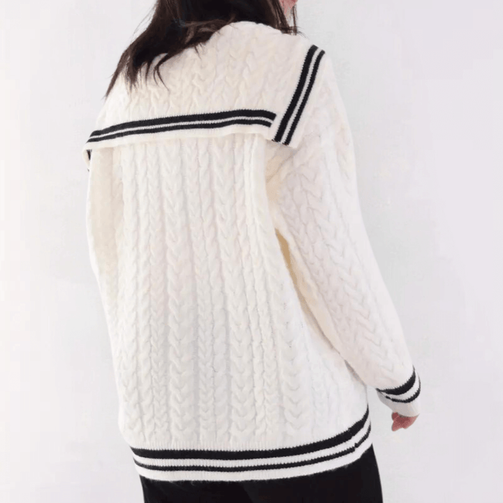 Woman wearing a warm, casual knit sweater, ideal for cozy fall and winter outfits.