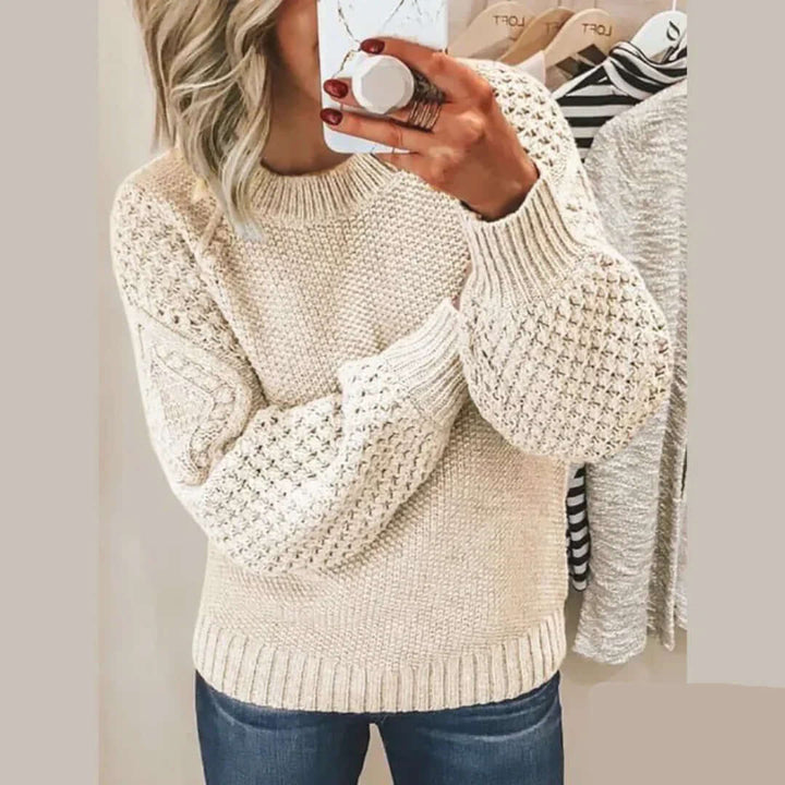 Soft knit women's long sleeve sweater with round neck. Versatile top for autumn & winter warmth.
