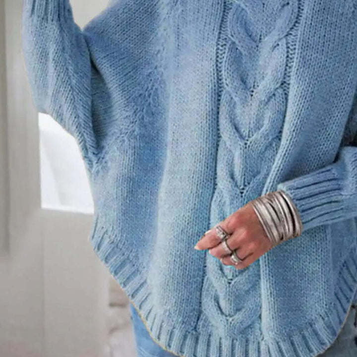 Fashionable women's cozy loose knitted turtleneck sweater, providing warmth and a stylish casual look.