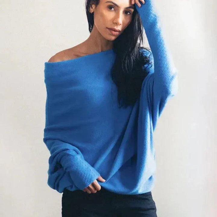 Versatile women's loose sweater in a soft knit, great for layering and casual yet chic fall outfits.