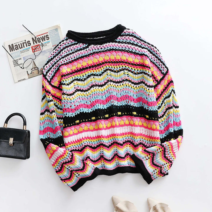 Women's cozy loose knit jumper. Stylish pullover sweater for casual wear and chic fall/winter outfits.