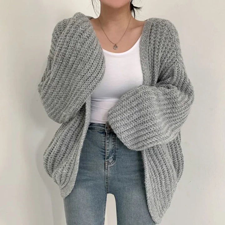 Relaxed fit women's cozy knit cardigan. Oversized lantern sleeves & open-front design for comfortable autumn style.