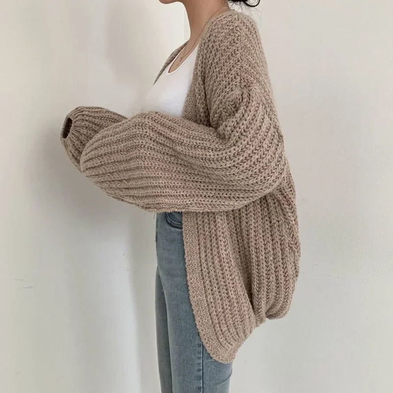 Women's soft oversized open-front cardigan. Cozy chunky knitwear with generous lantern sleeves for comfort.