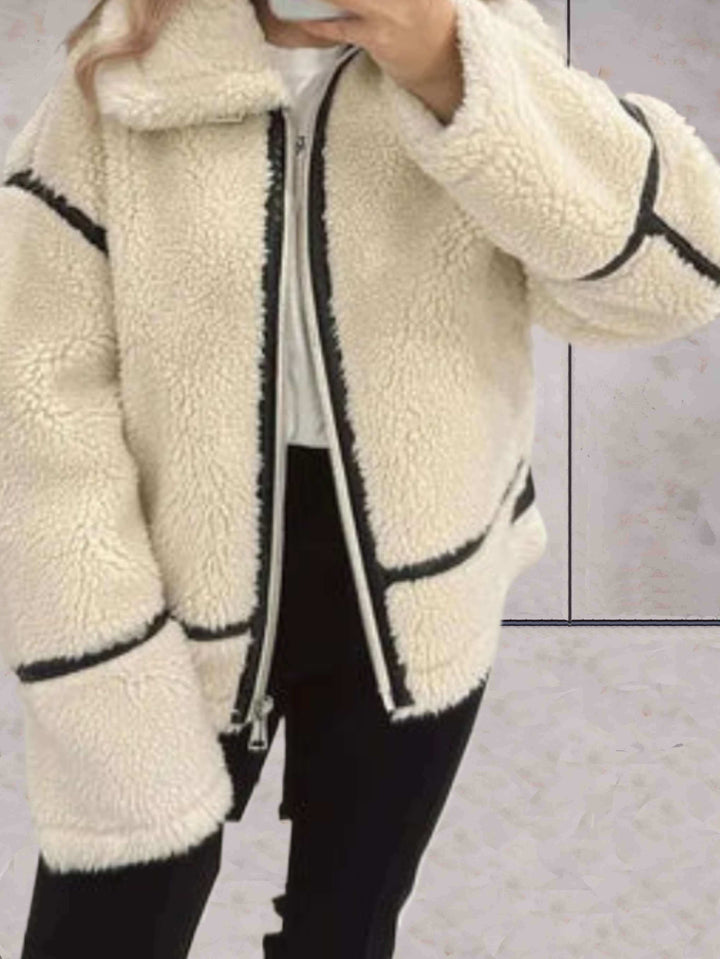 Women's cozy oversized beige fleece zip jacket. Comfortable outerwear perfect for fall and winter casual style.