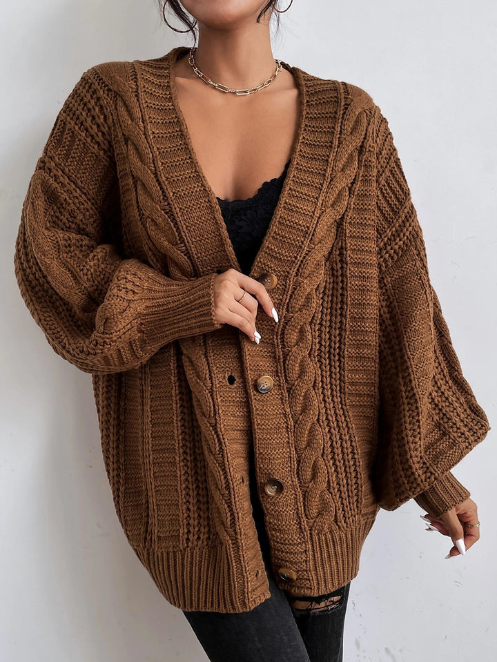 Oversized, cozy women's cable knit cardigan. Relaxed fit, perfect for comfortable casual autumn/winter fashion.