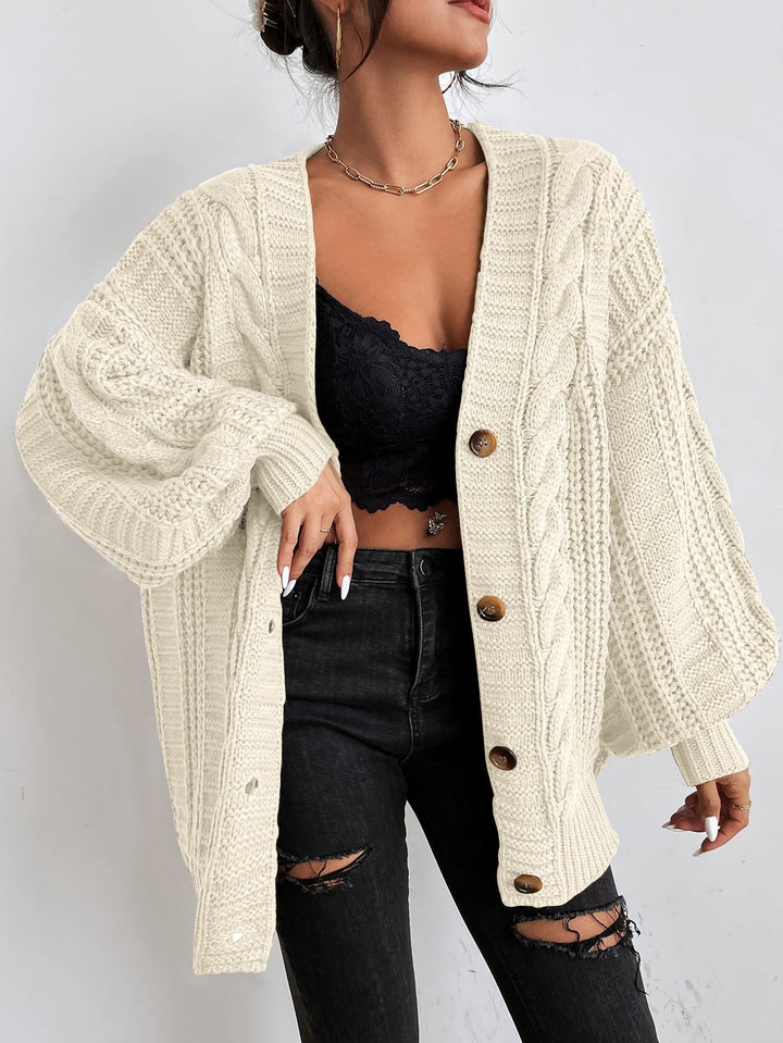 Versatile women's oversized cable cardigan. Cozy, comfortable, relaxed fit, ideal for autumn & winter layering.