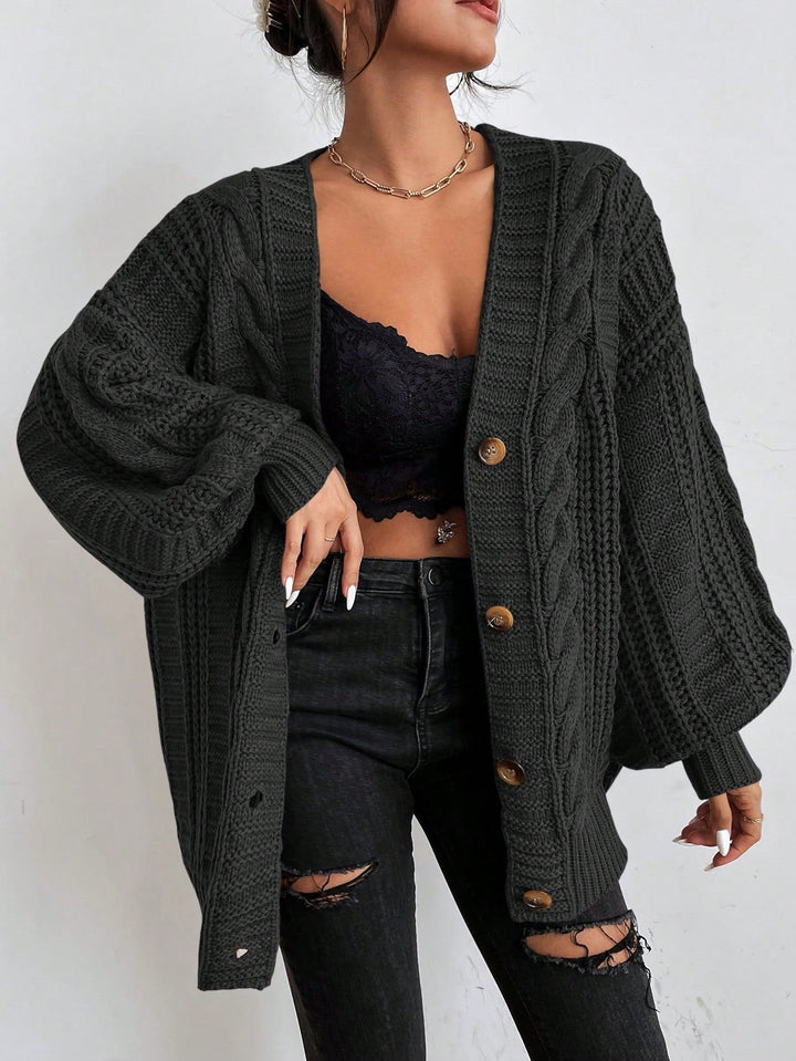 Super cozy women's oversized cable knit cardigan. Warm, relaxed fit, essential for cold autumn/winter fashion.