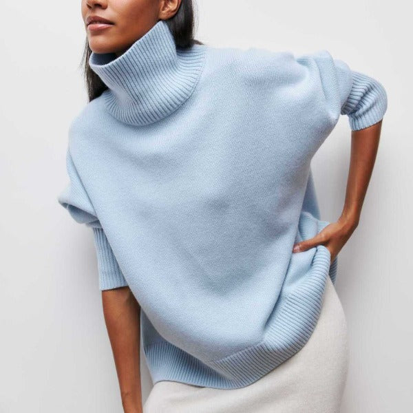 Women's cozy oversized knit turtleneck sweater. Perfect long sleeve comfort for fall and winter casual wear.