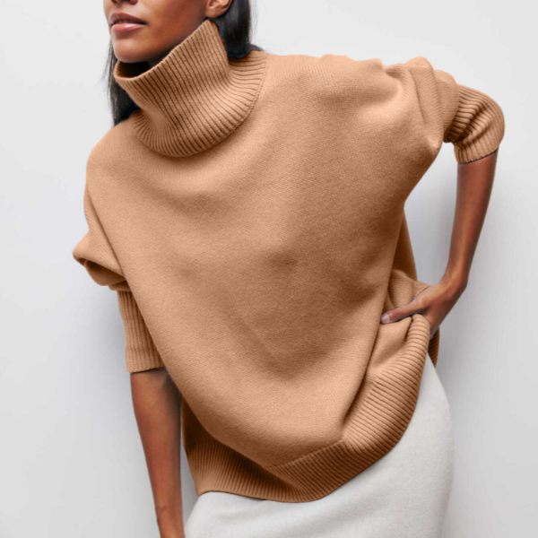 Cozy oversized turtleneck knit sweater for women. Stylish long-sleeve design, ideal for fall and winter.