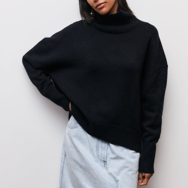 Warm women's oversized turtleneck sweater with a cozy knit fabric. Long sleeve casual comfort for fall/winter.