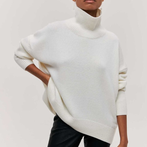 Soft knit oversized turtleneck sweater for women. Cozy long-sleeve design, great for fall, winter, & casual style.