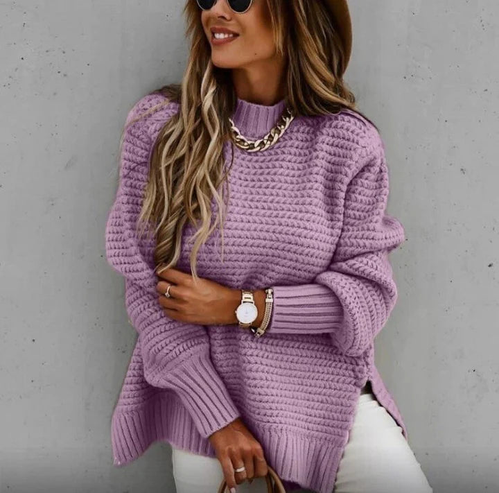 Elegant women's oversized pullover sweater. Knitted long-sleeve design provides cozy warmth & stylish comfort for winter.