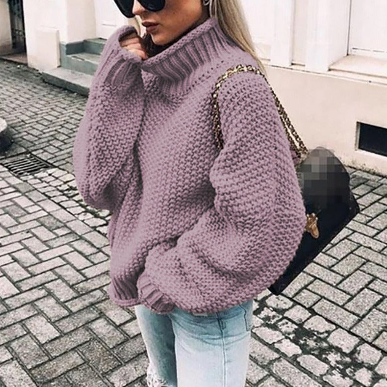 Elegant women's oversized turtleneck sweater in a soft knit, perfect for winter layering.