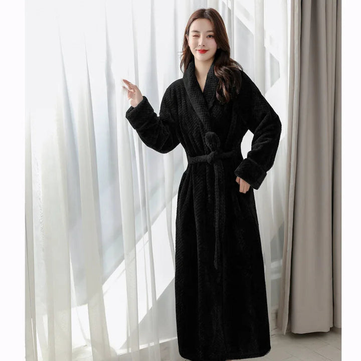 Cozy women's plush sleepwear robe, providing warmth & comfort after a bath.