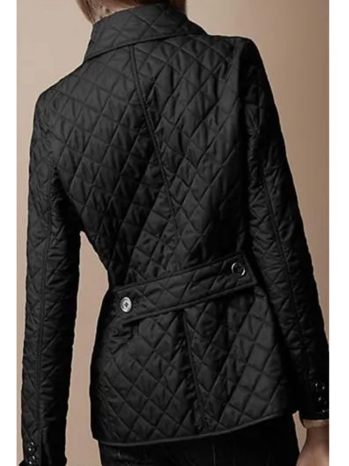 Stylish women's quilted jacket, relaxed fit & cozy comfort. Features turned-down collar & snap buttons.