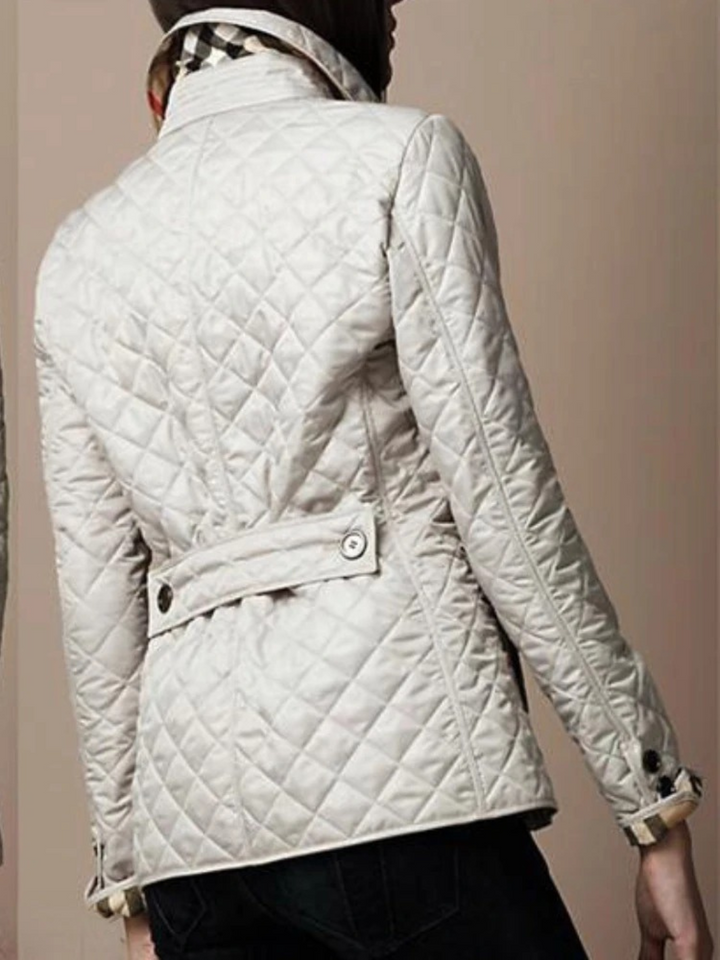 Fall fashion: Women's lightweight quilted jacket for cozy comfort. Features elegant turned-down collar.