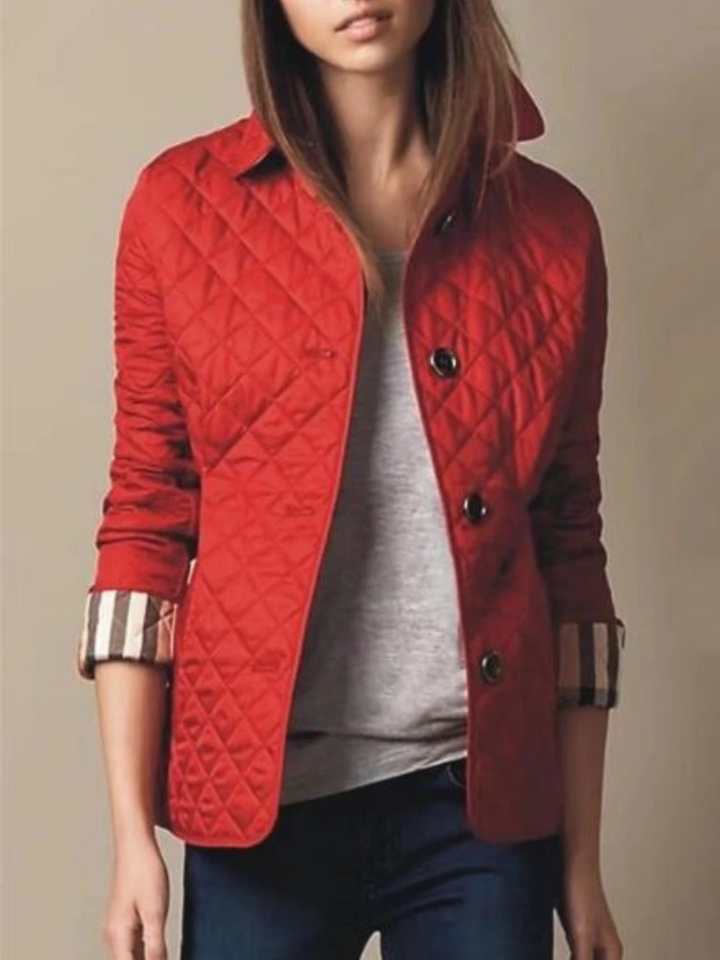 Cozy women's quilted jacket, a winter style essential. Features a turned-down collar and relaxed fit.