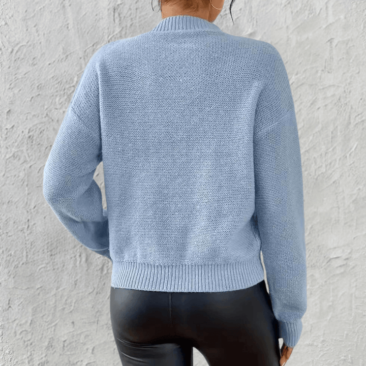 Comfortable long sleeve blue knit sweater for women, featuring a cozy relaxed fit; ideal for fall/winter fashion.