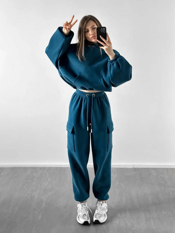 Women's cozy relaxed fit sweat suit, a stylish hoodie and jogger set for ultimate comfort and casual wear.