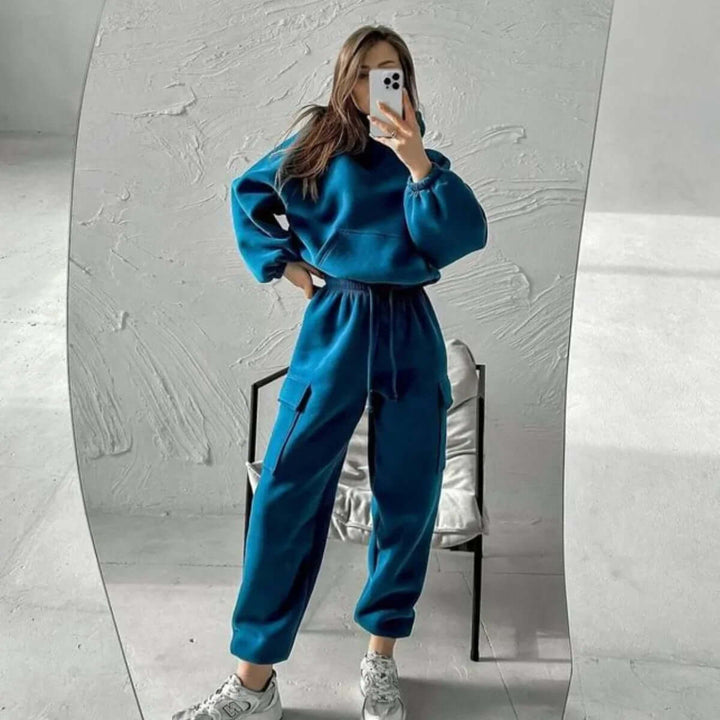 Complete women's cozy outfit: a relaxed fit hoodie and matching joggers, perfect for comfort wear.