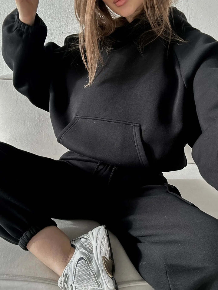 Versatile women's two-piece set; relaxed fit hoodie & joggers for casual wear, athleisure, or home comfort.