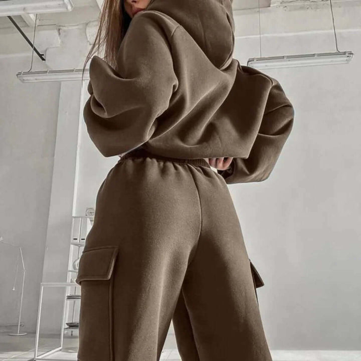 Full view of a woman in a relaxed fit cozy hoodie & jogger set, perfect for comfort wear.