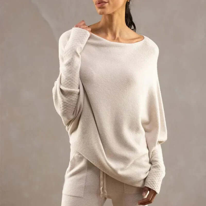 Women's cozy relaxed fit soft knit sweater, perfect for comfortable winter fashion. Versatile and chic.