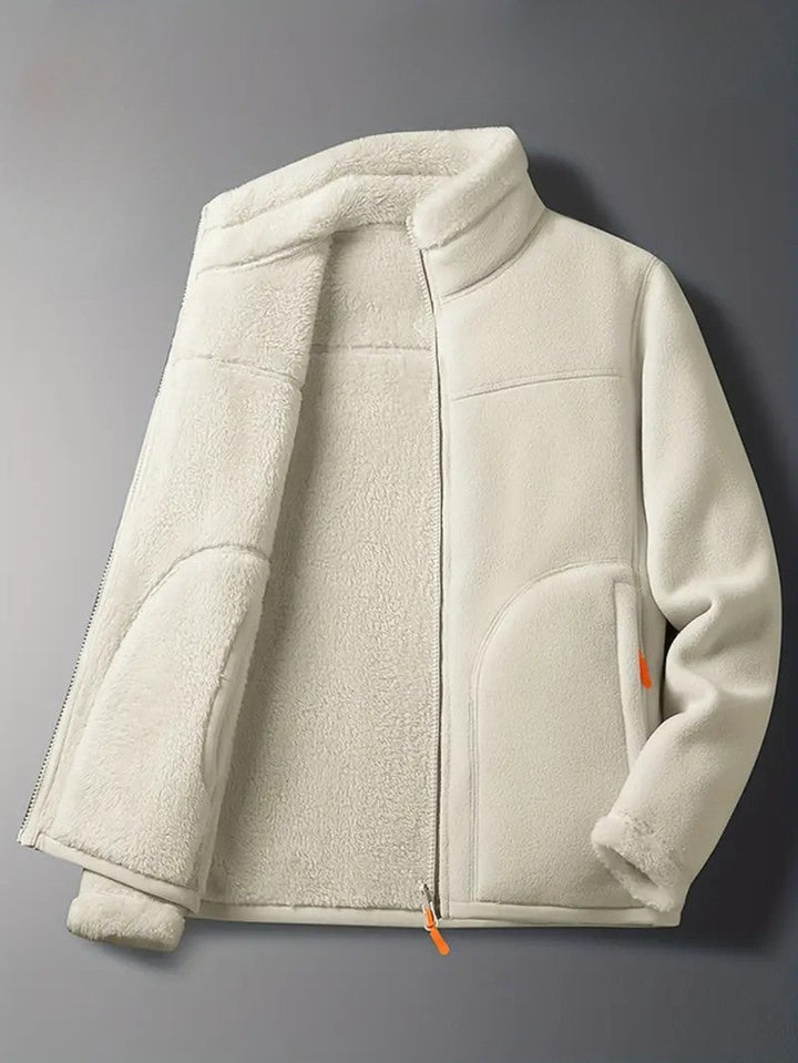Women's reversible winter jacket, partially open, showing cozy interior & stylish stand collar design.