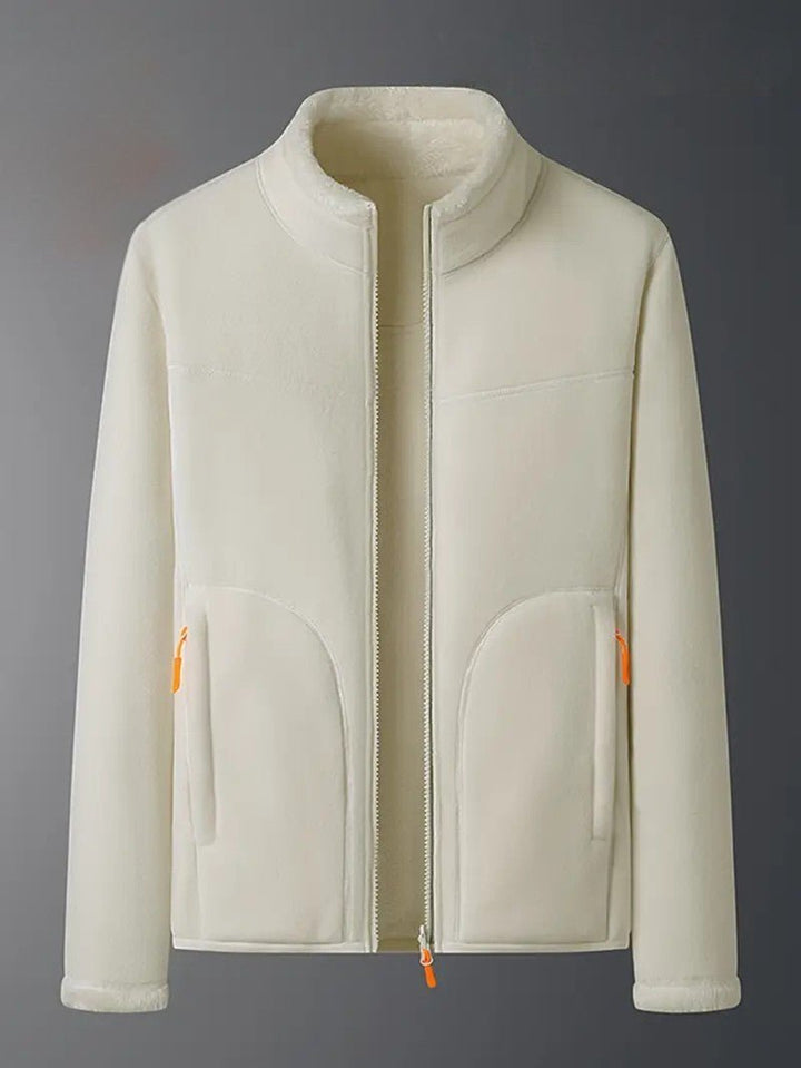 Neatly folded women's reversible winter jacket, cozy & warm, ready for stylish fall/winter wear.