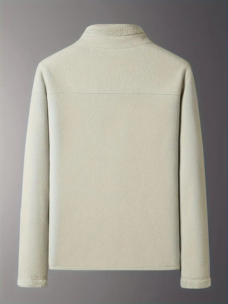 Hanging women's reversible winter jacket, showcasing its stand collar & zip-up casual design.