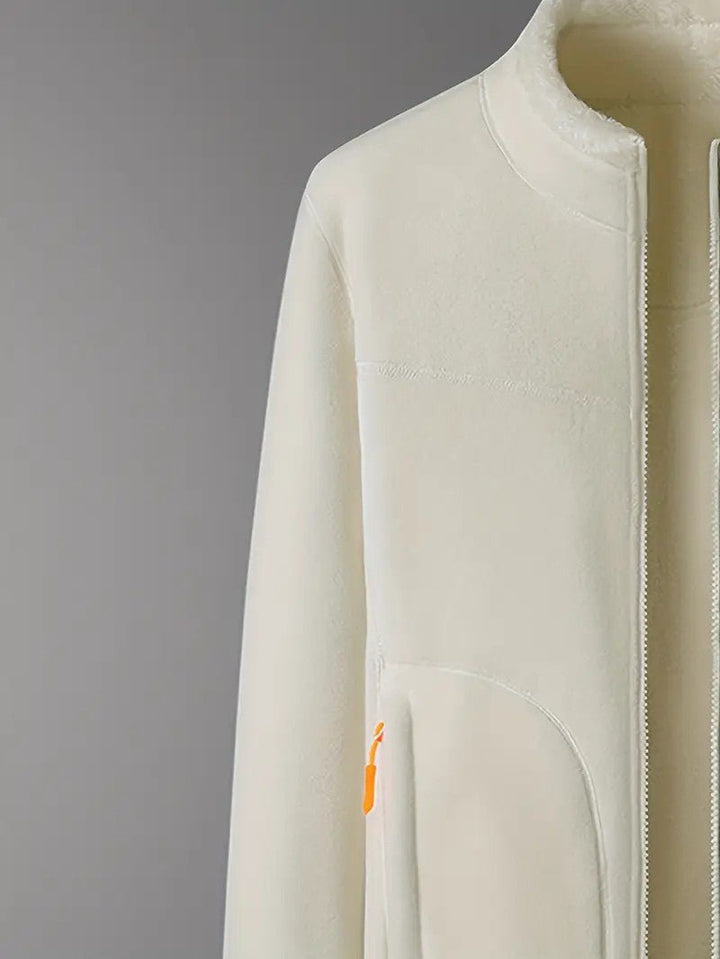 Angled view of a women's reversible winter jacket, stand collar & zip-up, perfect for cold weather.