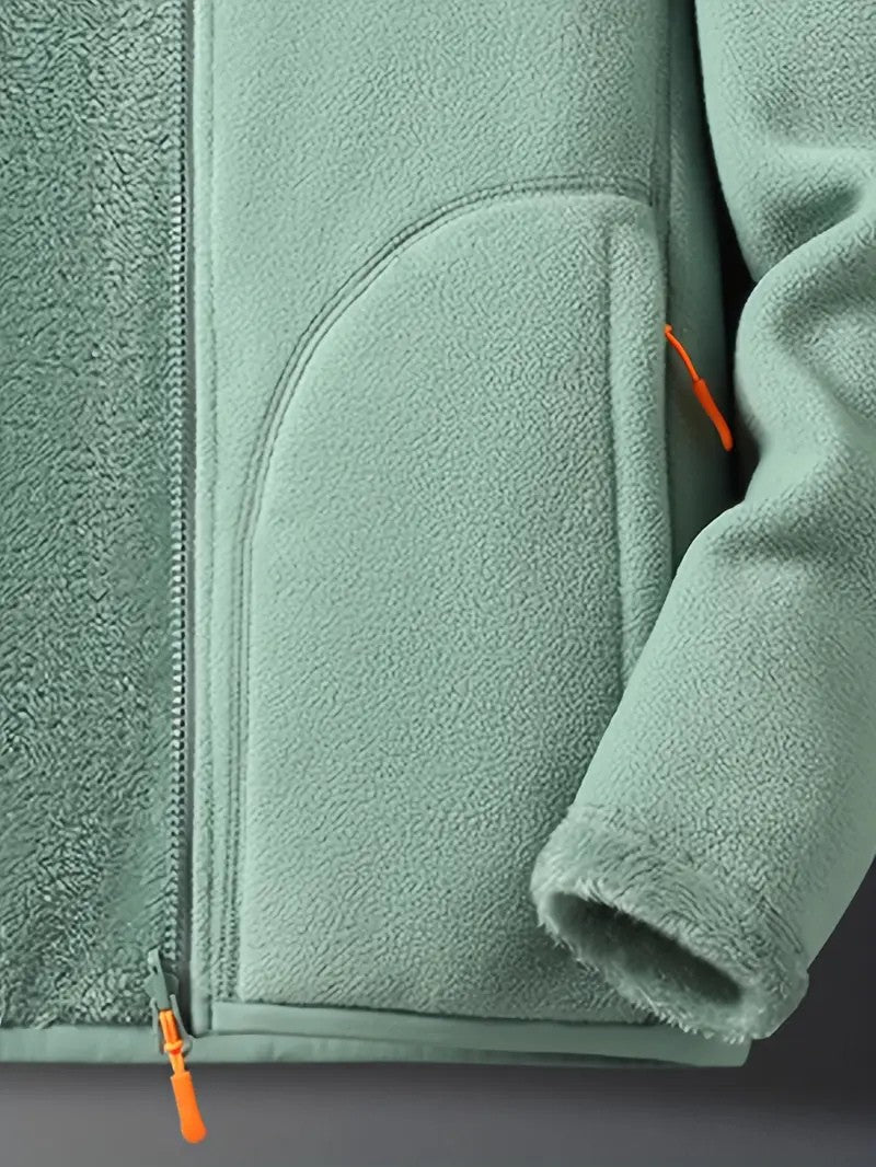 Women's reversible winter jacket laid flat, showing cozy texture & zip-up stand collar design.