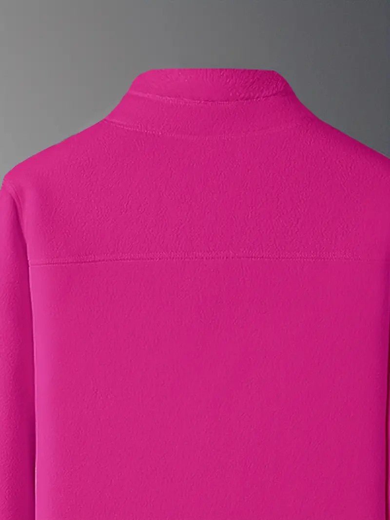 Woman walking in a warm reversible winter jacket, zip-up stand collar, perfect for active wear.