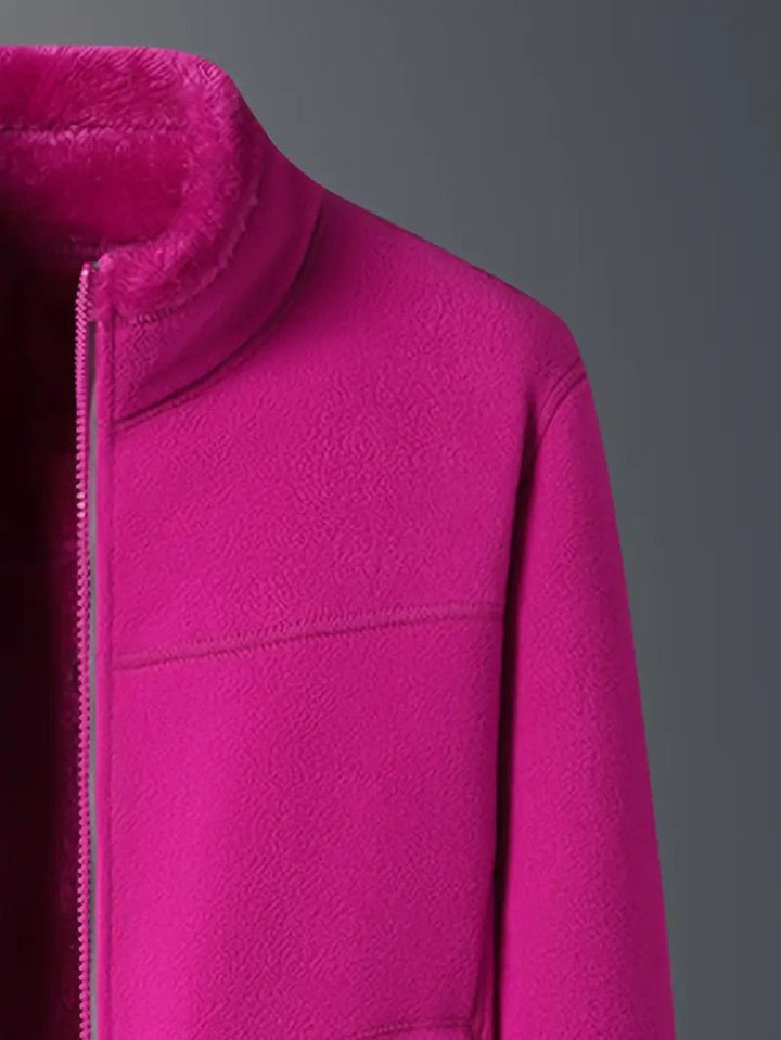 Full length view of women's reversible winter jacket, cozy, zip-up, and stylish for fall/winter.