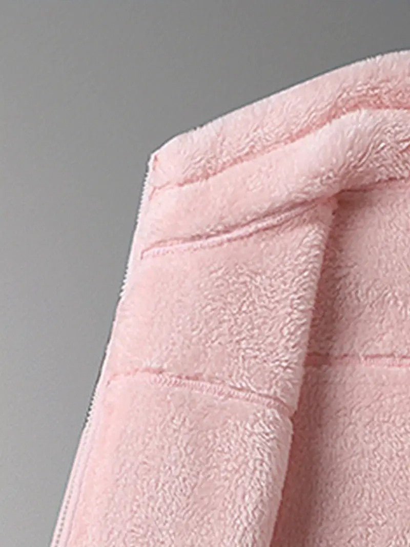 Detail of cozy stand collar on a women's reversible winter jacket, ensuring extra neck warmth & style.