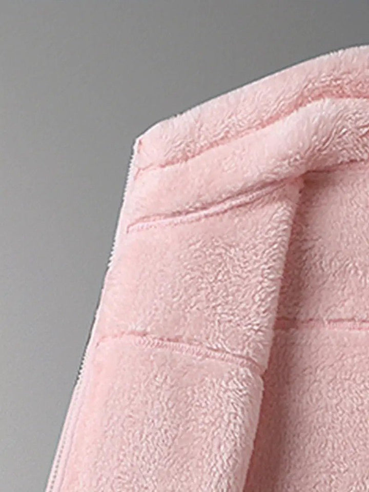 Detail of cozy stand collar on a women's reversible winter jacket, ensuring extra neck warmth & style.