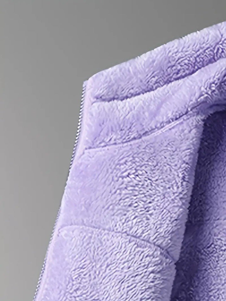 Warm & fluffy women's reversible winter jacket with a cozy stand collar, essential for cold days.