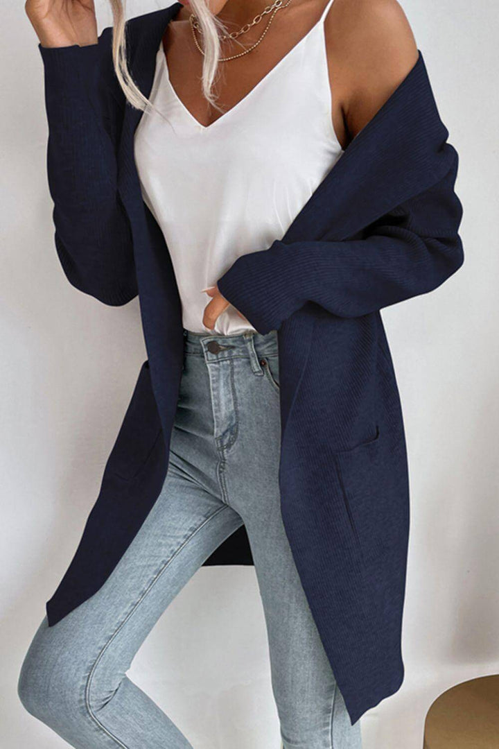 Women's cozy ribbed knit hooded cardigan with pockets, perfect for fall casual wear.