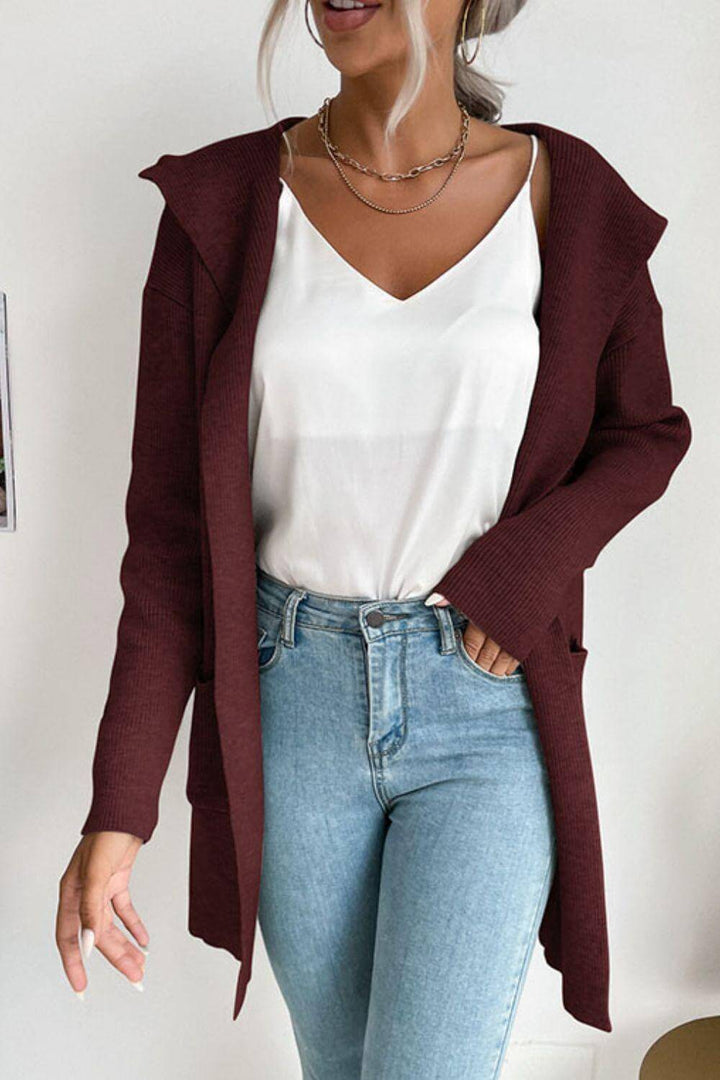 Comfortable women's long sleeve ribbed hooded cardigan, featuring cozy pockets and an open-front style.