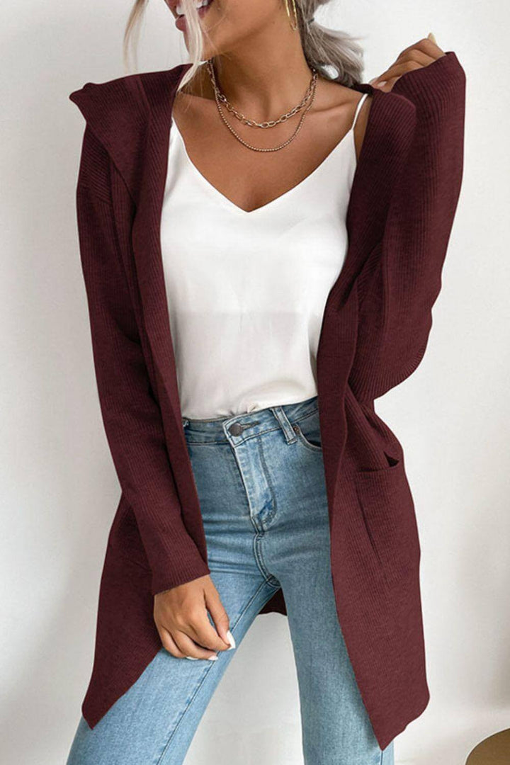 Versatile women's hooded ribbed cardigan, an open-front sweater with pockets, great for layering casual outfits.