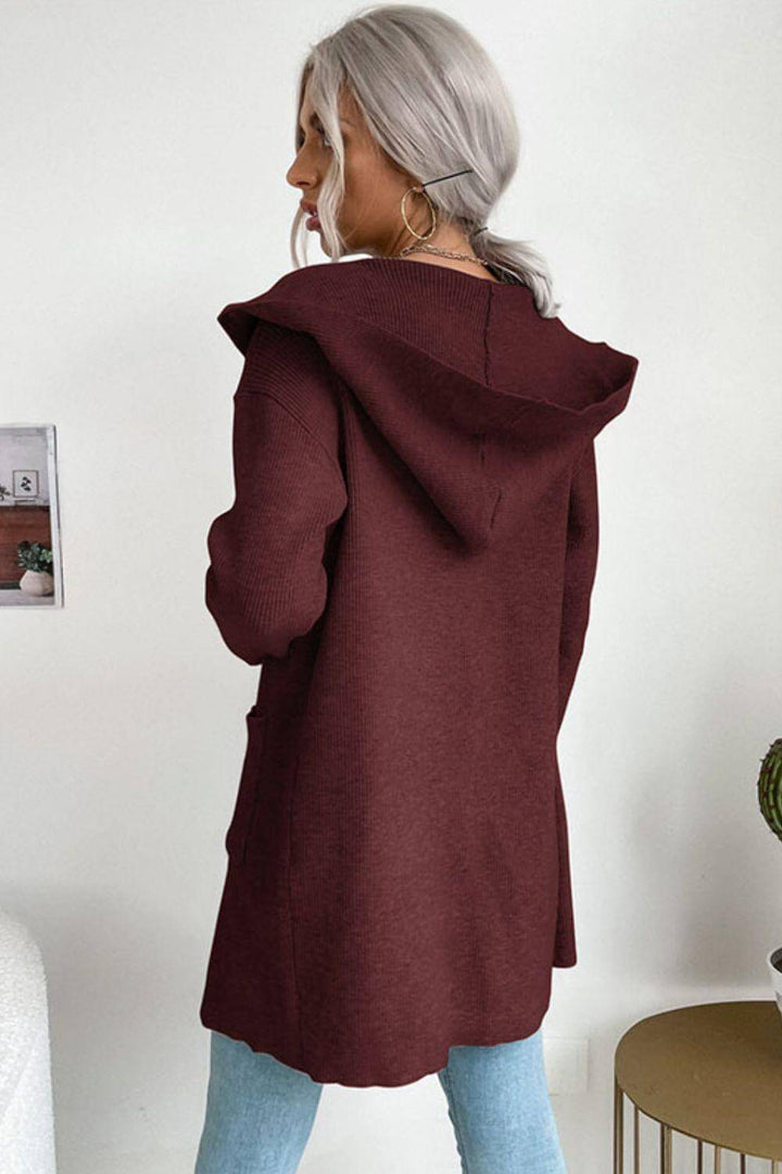 Soft ribbed knit hooded cardigan for women, open front with cozy pockets, a must-have piece for fall fashion.