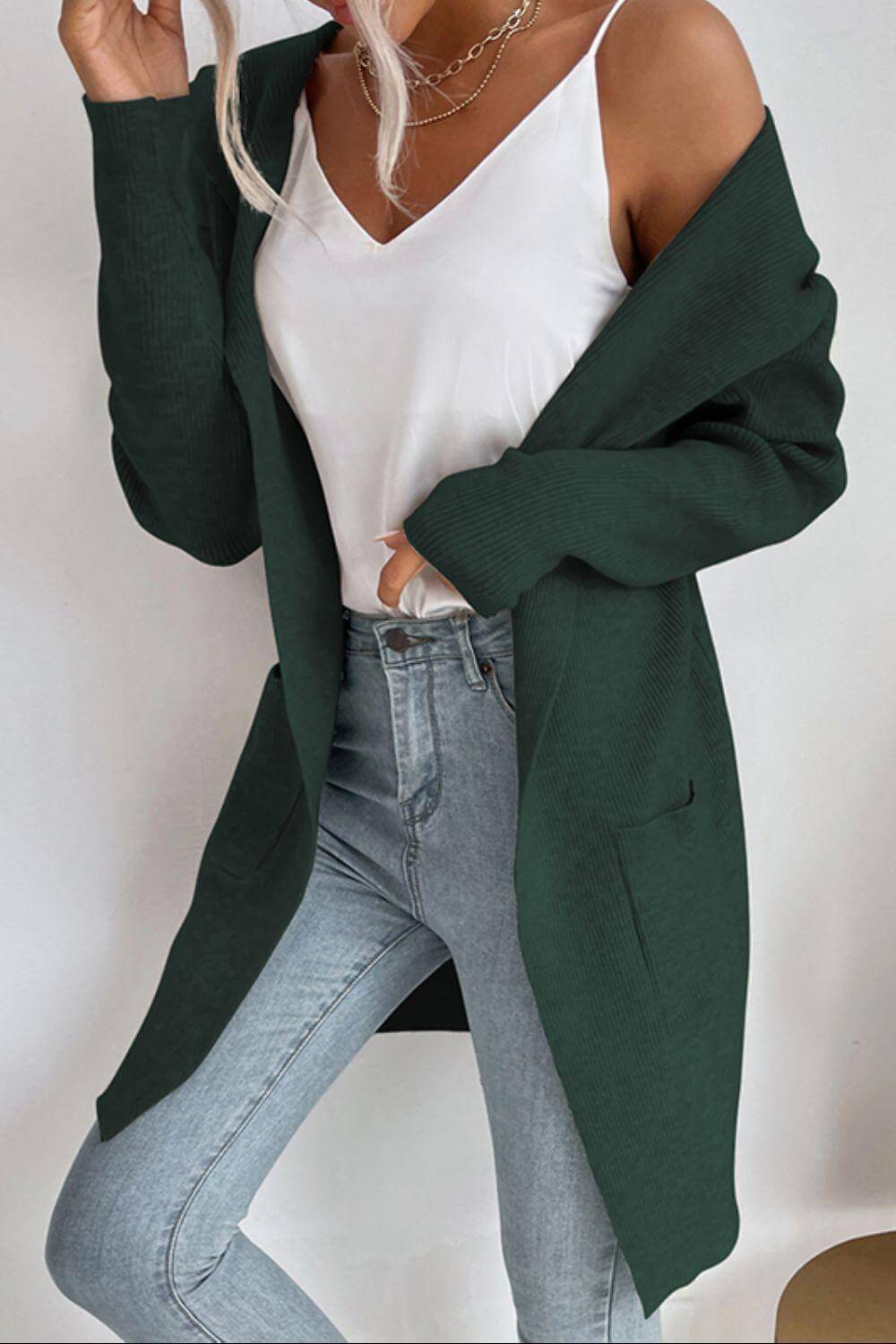 Warm women's ribbed long sleeve hooded cardigan with pockets, perfect cozy outerwear for cooler weather.