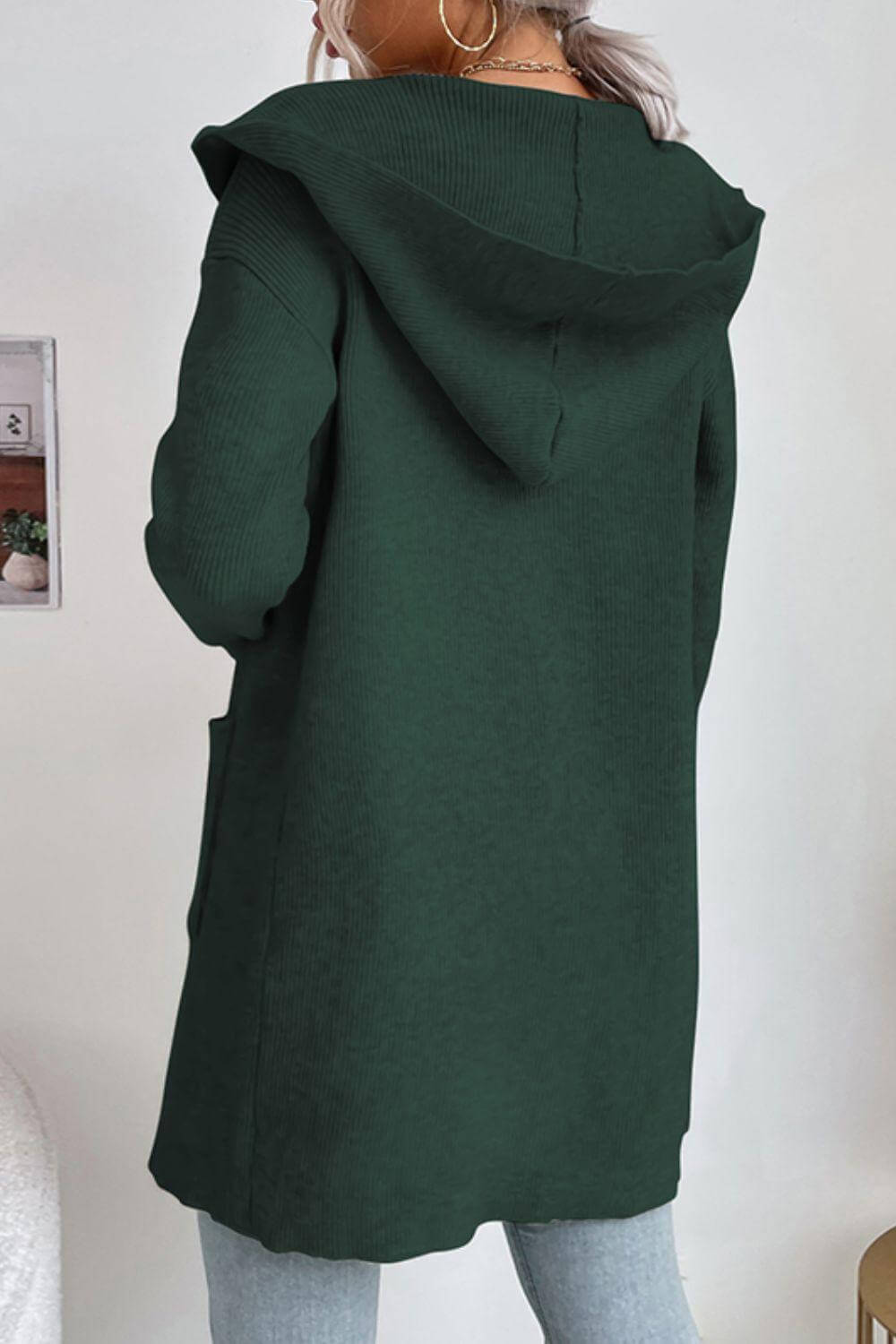Stylish women's hooded ribbed knit cardigan, open-front design with pockets, offering warmth and comfort.