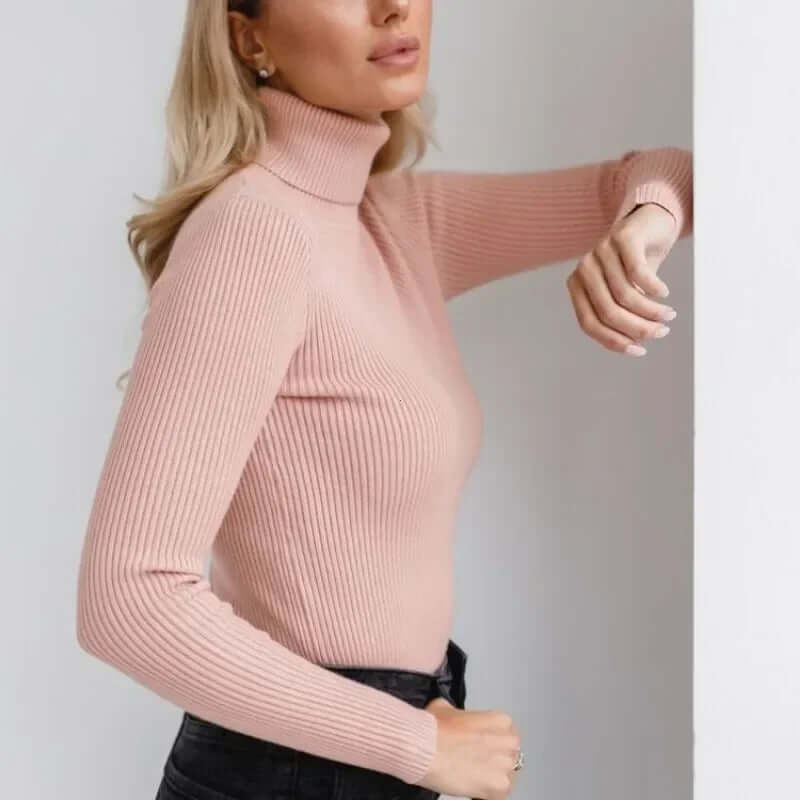 Detailed view of a cozy women's knit ribbed turtleneck sweater, perfect for cold weather fashion.