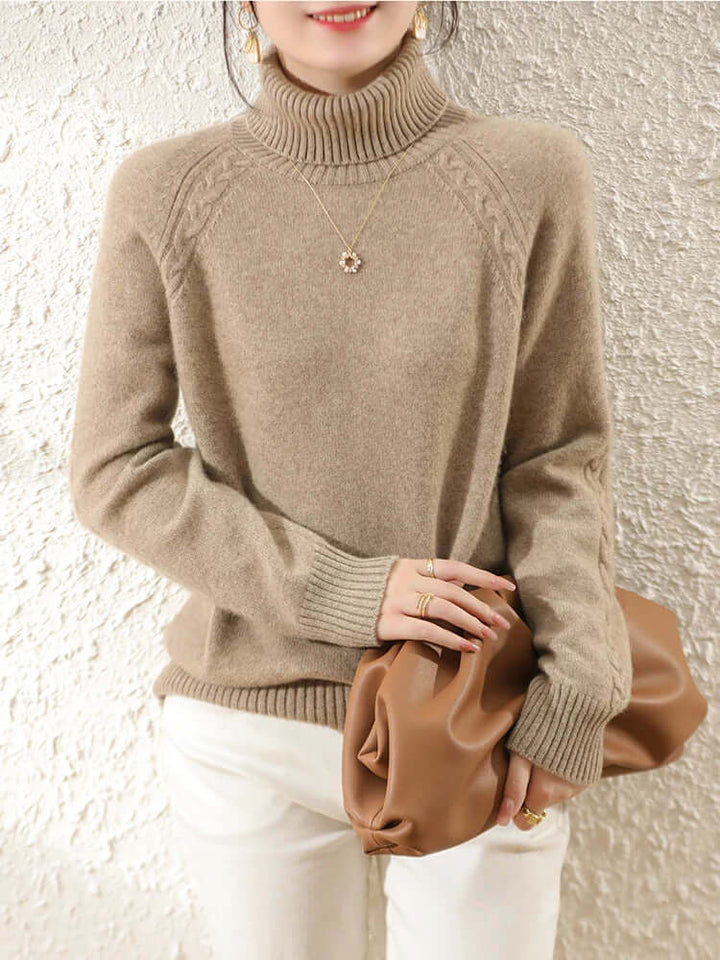 Women's cozy roll neck knitted apparel. Stylish long sleeve warm sweater for winter.
