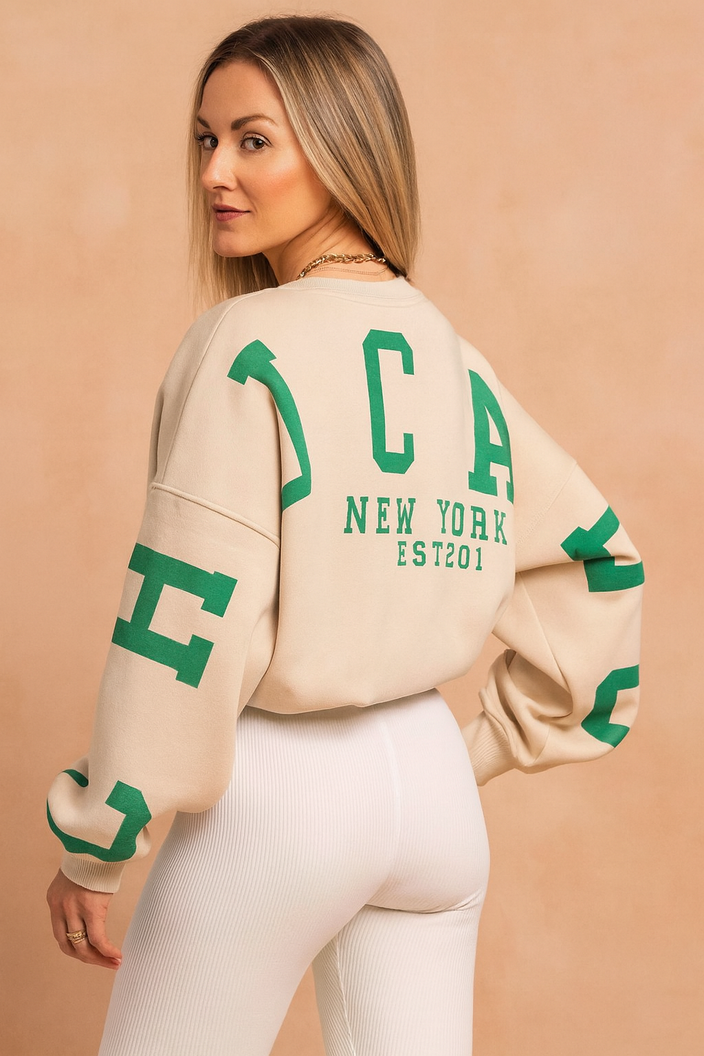 Relaxed fit women's long-sleeve round neck sweater. Effortlessly comfortable casual top, ideal for cozy fall fashion.
