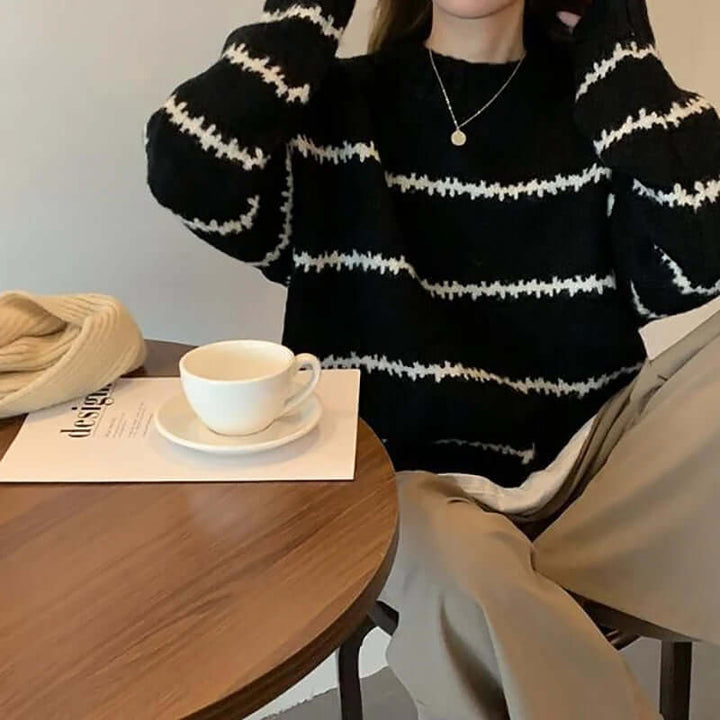 Chic women's striped round neck sweater, a cozy knitted long sleeve top for stylish casual wear.