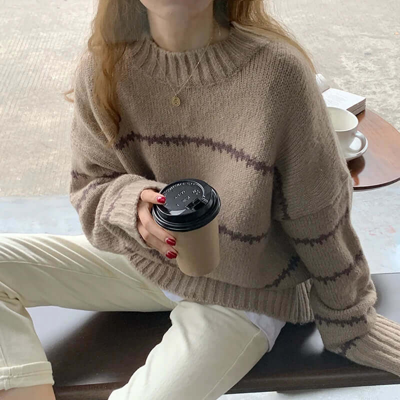 Versatile women's striped knitted round neck sweater, a soft long sleeve top for cozy fall & winter outfits.